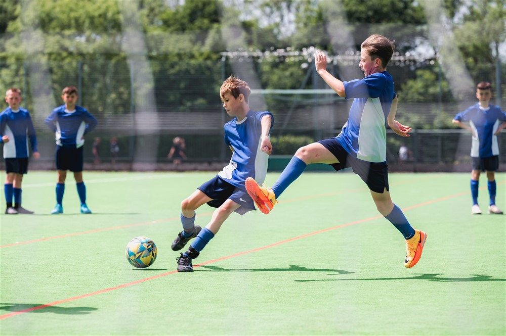 Photo of students playing football 