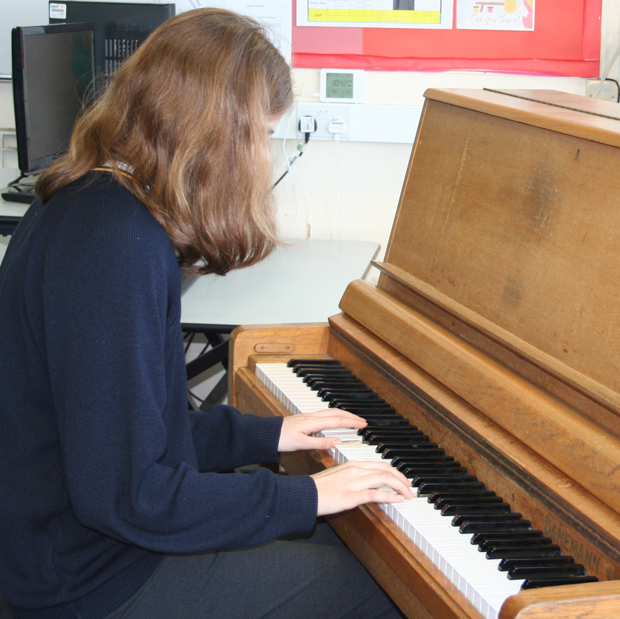 Student playing piano