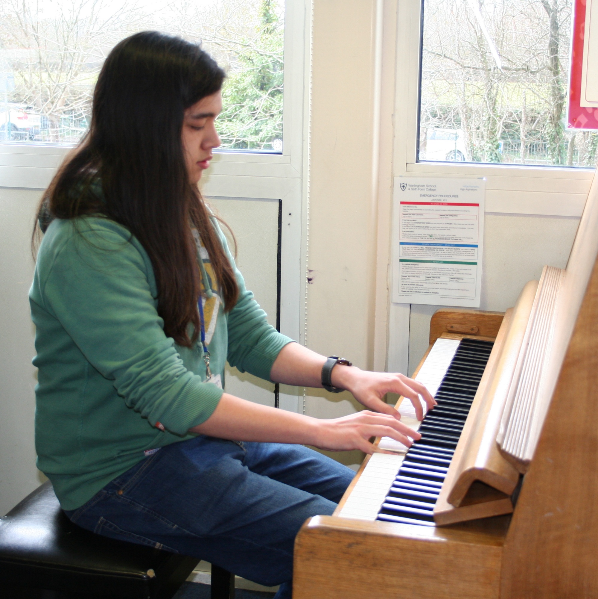 Year 13 A Level Student playing piano 